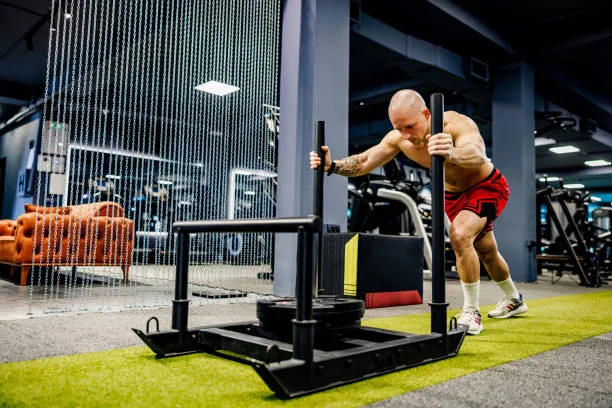 Athlete performing strength exercises tailored by blood-based fitness training