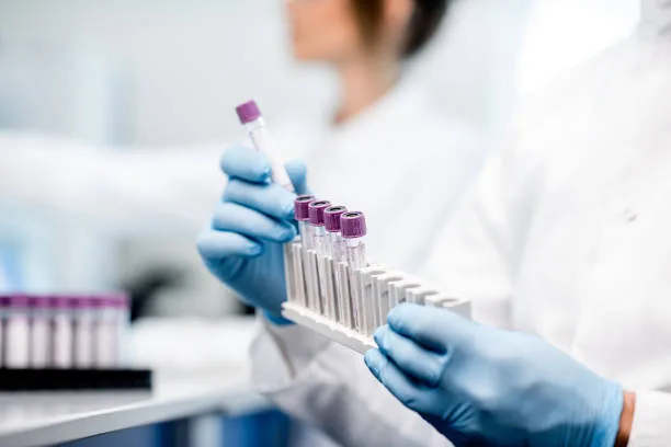 Lab technician preparing samples for men’s integrative health testing