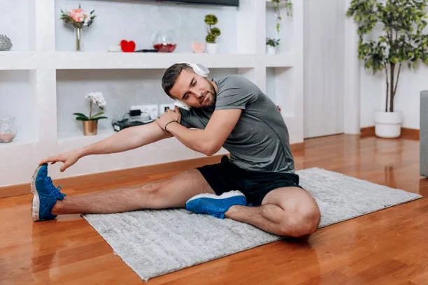 Male athlete following structured fitness routines for men at home