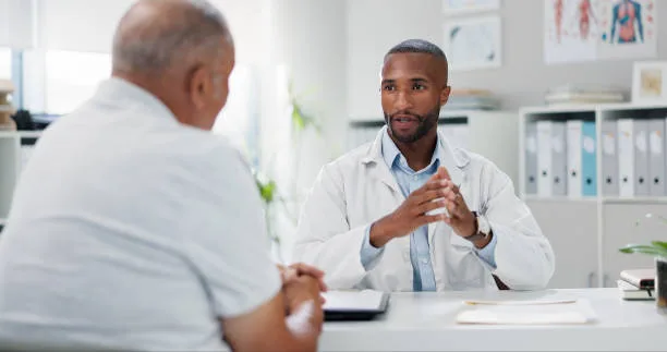 Patient consulting a doctor about diabetes medication and cholesterol management