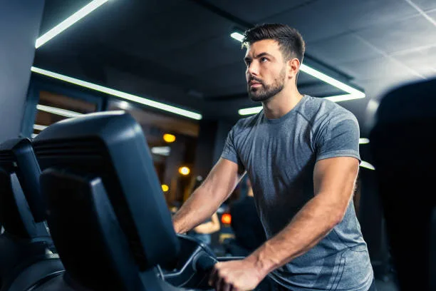 Close-up of a person using a treadmill for low-intensity steady state cardio