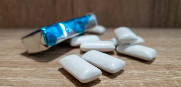 A pack of sugar-free gum placed on a minimalist kitchen counter