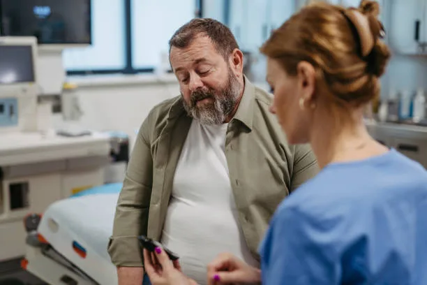 Doctor explaining fasting insulin results to a patient during consultation